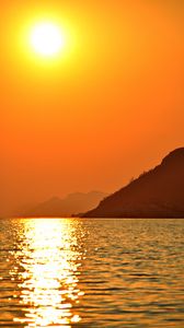 Preview wallpaper sun, glare, sunset, sea, mountains
