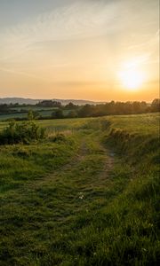 Preview wallpaper sun, grass, road, distance