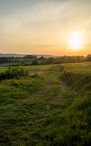 Preview wallpaper sun, grass, road, distance