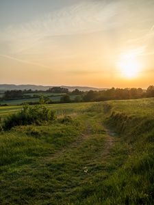 Preview wallpaper sun, grass, road, distance