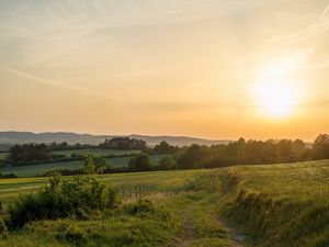 Preview wallpaper sun, grass, road, distance