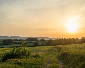 Preview wallpaper sun, grass, road, distance