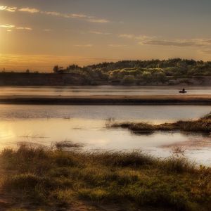 Preview wallpaper sun, light, lake, fisherman, coast, grass, faded, reflection