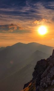 Preview wallpaper sun, light, rock, person, clouds, sky, height, climber, conquest