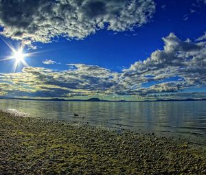 Preview wallpaper sun, light, stones, coast, relief