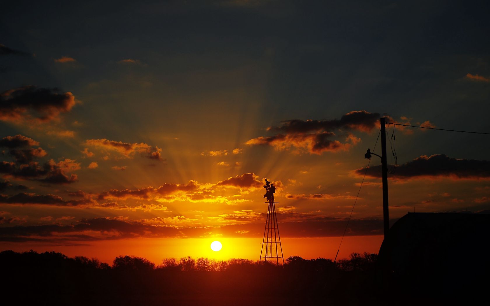 1680x1050 Wallpaper sun, rays, clouds, sky, sunset, dark, landscape