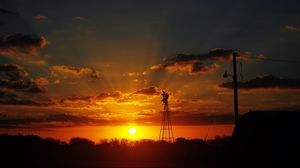 Preview wallpaper sun, rays, clouds, sky, sunset, dark, landscape