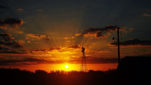 Preview wallpaper sun, rays, clouds, sky, sunset, dark, landscape