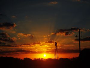 Preview wallpaper sun, rays, clouds, sky, sunset, dark, landscape