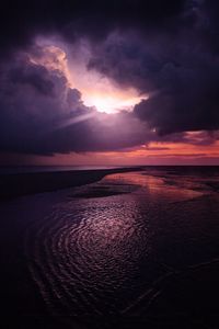 Preview wallpaper sun, rays, dusk, coast, clouds