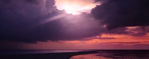 Preview wallpaper sun, rays, dusk, coast, clouds