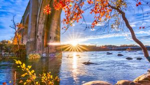 Preview wallpaper sun, rays, river, trees, bridge, landscape