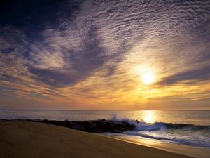 Preview wallpaper sun, sky, clouds, sea, waves, stones, breakwater