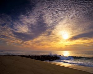 Preview wallpaper sun, sky, clouds, sea, waves, stones, breakwater