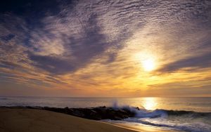 Preview wallpaper sun, sky, clouds, sea, waves, stones, breakwater