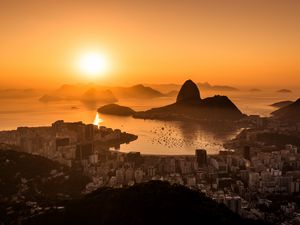 Preview wallpaper sun, sunset, city, shore