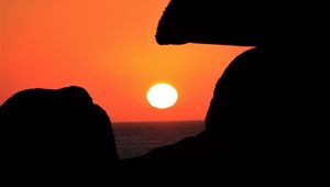 Preview wallpaper sun, sunset, cliffs, dark