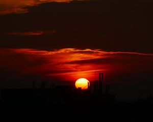 Preview wallpaper sun, sunset, clouds, building, dark