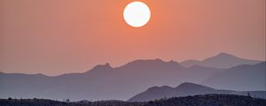Preview wallpaper sun, sunset, mountains, hills, fog