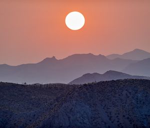 Preview wallpaper sun, sunset, mountains, hills, fog