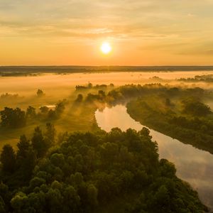 Preview wallpaper sun, sunset, river, fog, trees