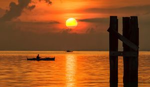 Preview wallpaper sun, sunset, sea, boats, pier