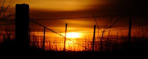 Preview wallpaper sun, sunset, silhouettes, grass, clouds, sky, dark