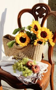 Preview wallpaper sunflowers, grapes, peach, basket, chair, flowers