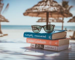 Preview wallpaper sunglasses, books, beach, sun