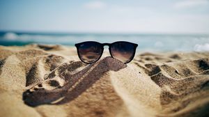 Preview wallpaper sunglasses, glasses, sand, sea