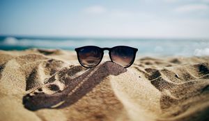 Preview wallpaper sunglasses, glasses, sand, sea