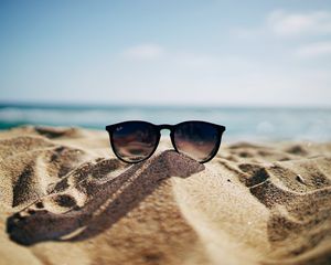 Preview wallpaper sunglasses, glasses, sand, sea