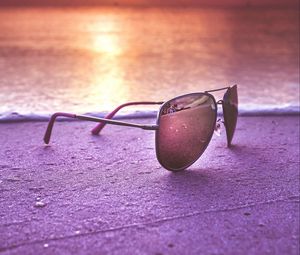 Preview wallpaper sunglasses, glasses, sea, sunset