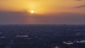 Preview wallpaper sunrise, buildings, city, sky, clouds