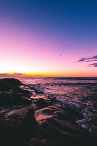 Preview wallpaper sunset, beach, sea, stones