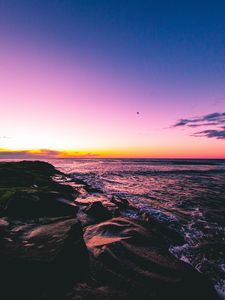 Preview wallpaper sunset, beach, sea, stones