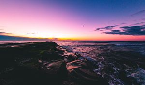 Preview wallpaper sunset, beach, sea, stones