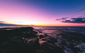 Preview wallpaper sunset, beach, sea, stones