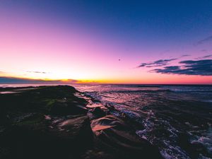 Preview wallpaper sunset, beach, sea, stones