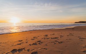 Preview wallpaper sunset, beach, sea, sand, water