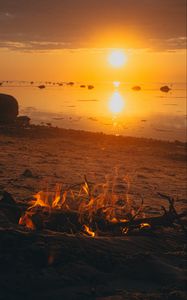 Preview wallpaper sunset, bonfire, coast, sand