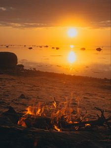 Preview wallpaper sunset, bonfire, coast, sand