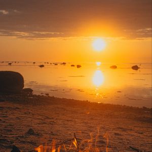 Preview wallpaper sunset, bonfire, coast, sand