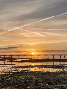 Preview wallpaper sunset, bridge, sea, horizon, sky