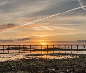 Preview wallpaper sunset, bridge, sea, horizon, sky