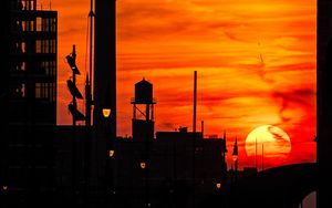 Preview wallpaper sunset, buildings, silhouettes, sky