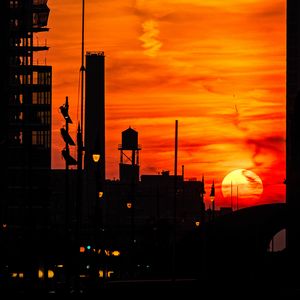 Preview wallpaper sunset, buildings, silhouettes, sky