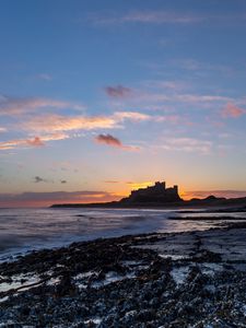 Preview wallpaper sunset, castle, coast, waves, horizon