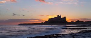 Preview wallpaper sunset, castle, coast, waves, horizon