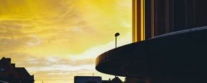 Preview wallpaper sunset, city, architecture, evening, shadows, yellow